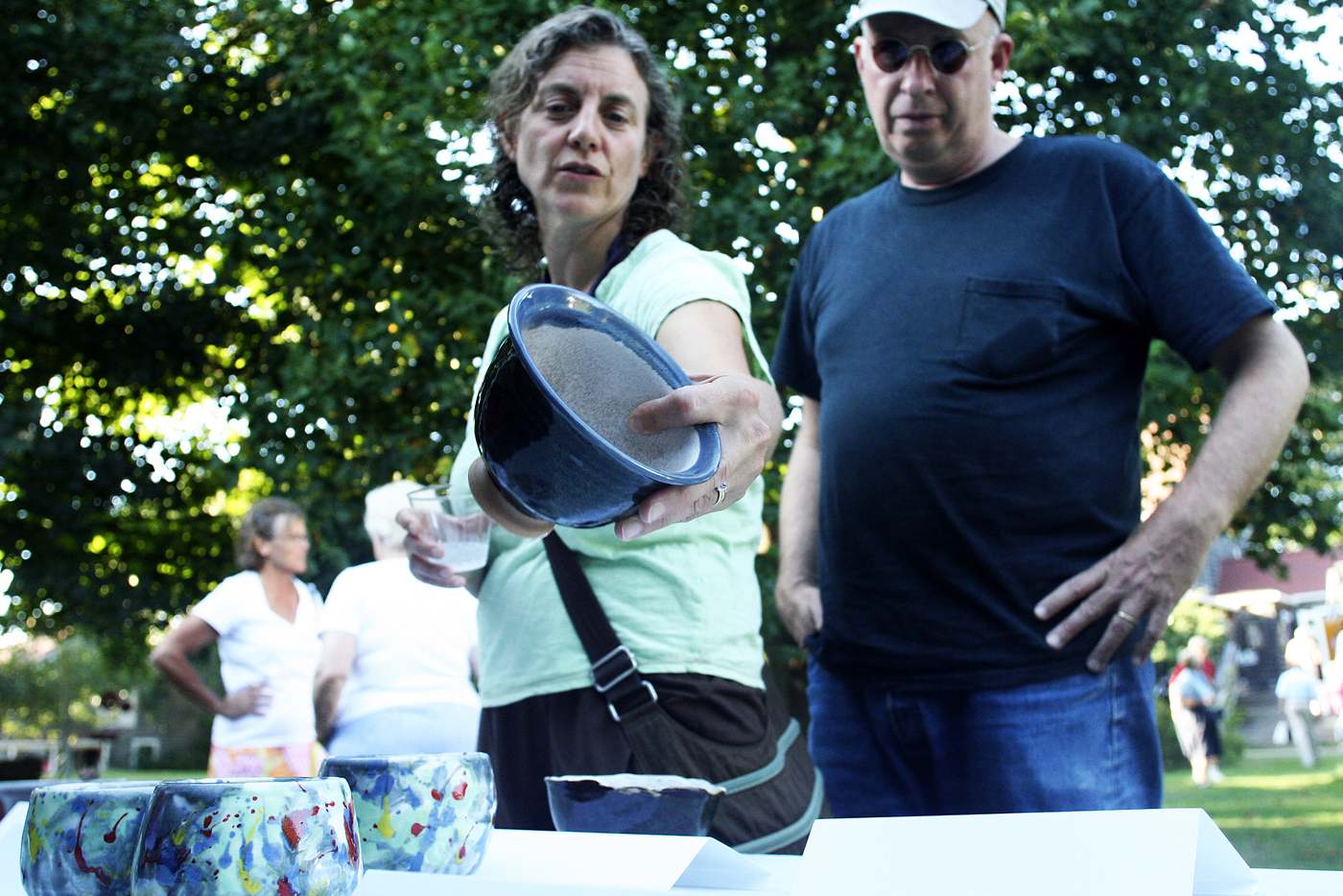 couple looks at pottery