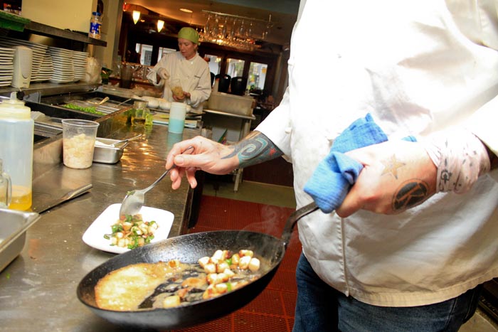chef plating food skillet