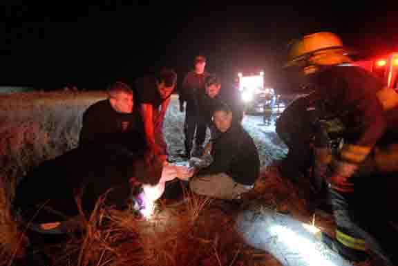 plane crash victim being treated on beach