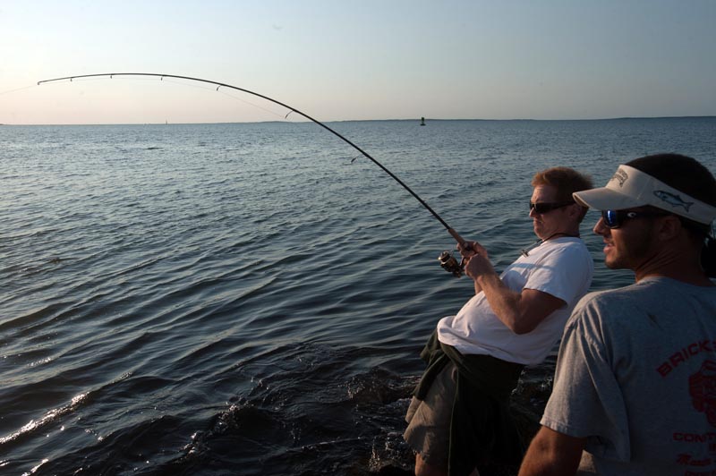 Chris Reimann and Joe Rogers fish at sunset