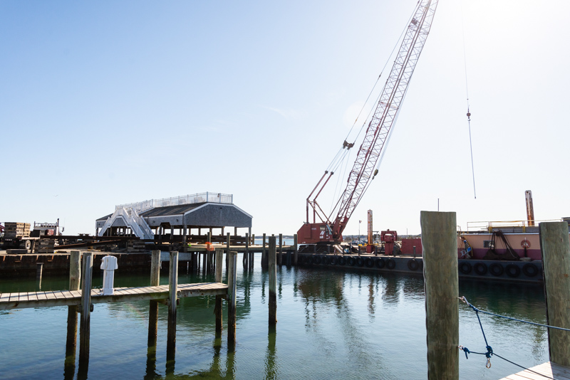 Crane barge has been stationed at the wharf all winter. The contractor is BTT Marine of Boston.