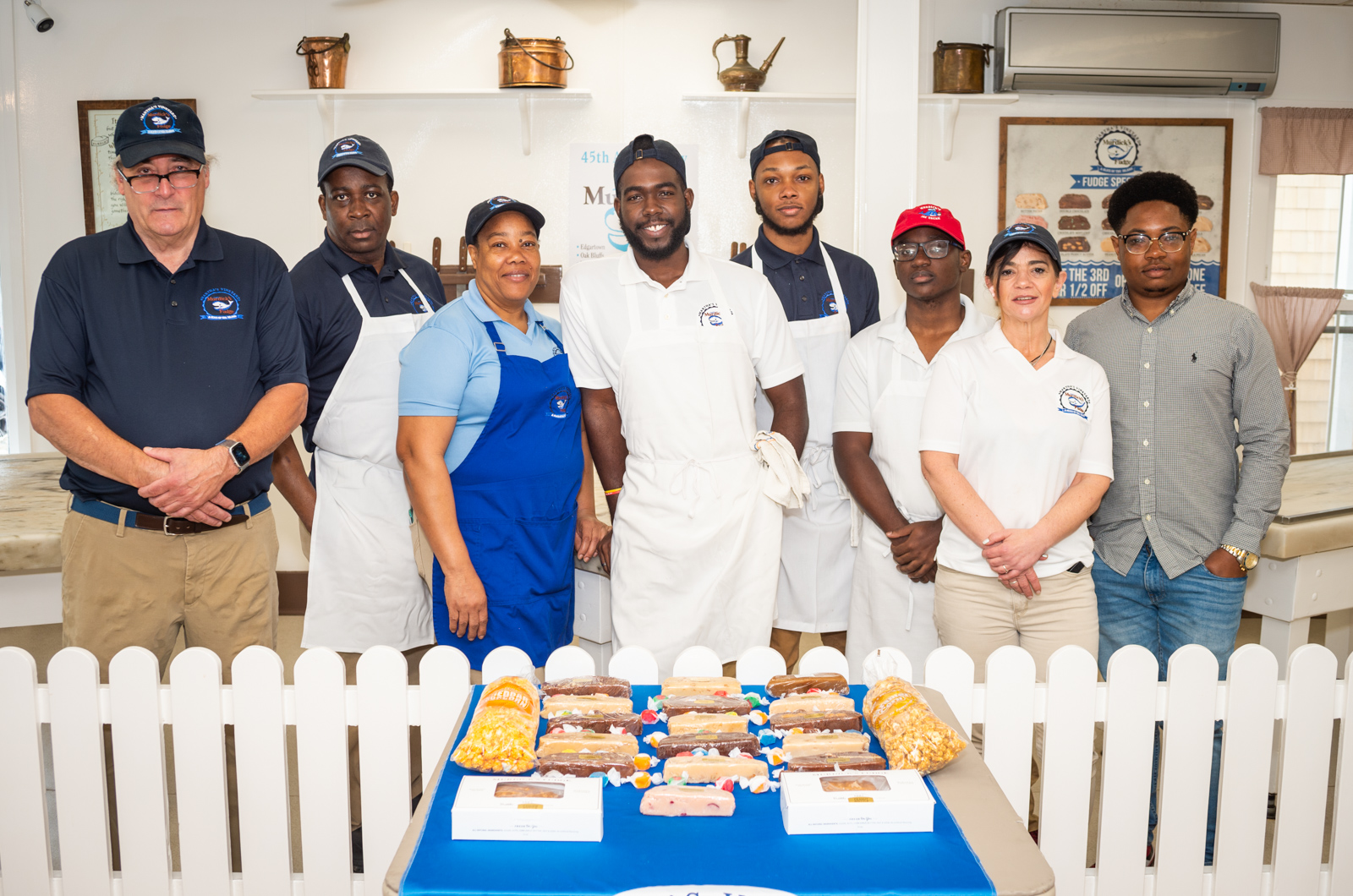 Mike McCourt (left) with the Murdick's fudge team.