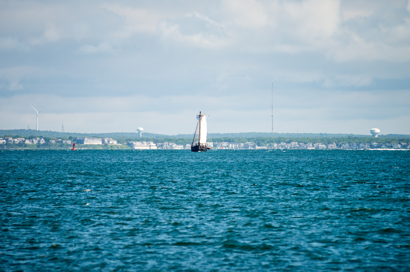 The Amistad becomes visible as it rounds West Chop and turns toward Vineyard Haven Harbor.