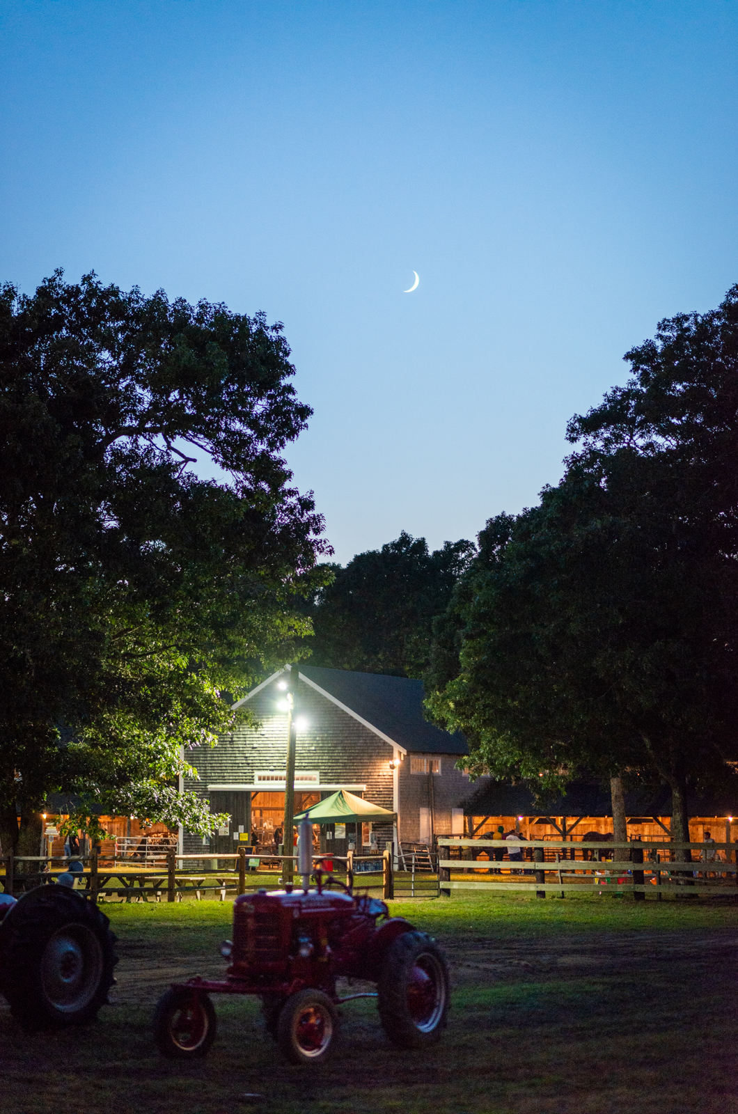 The moon rises over the fair.