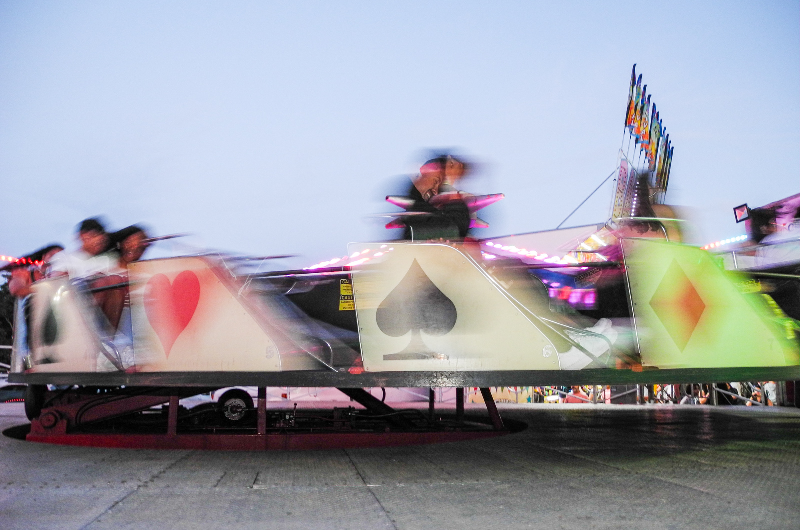 Rides spin and riders ride into the night.