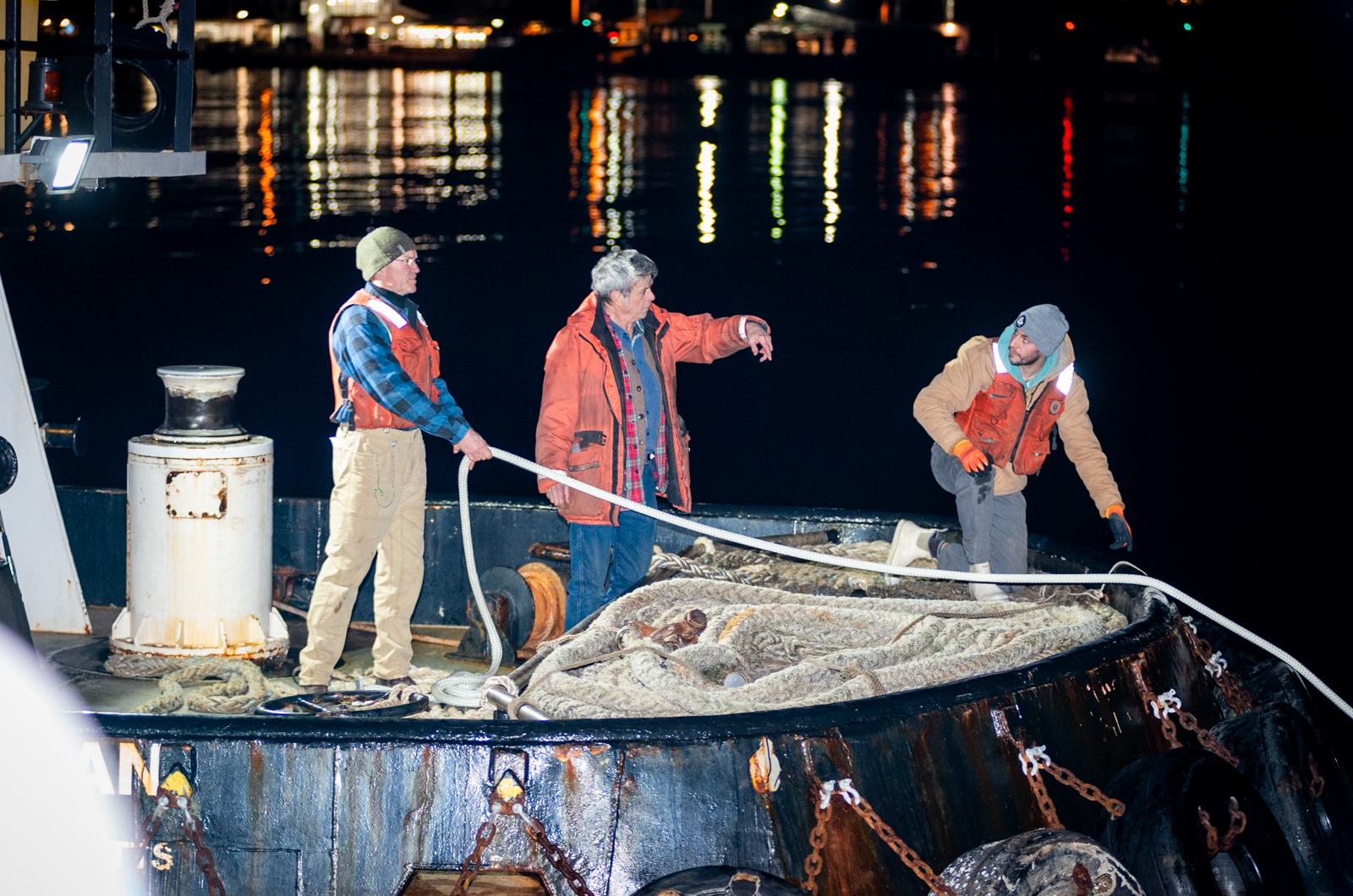 Thuban crew helping to pull whale into position, Billy Mabie (center).