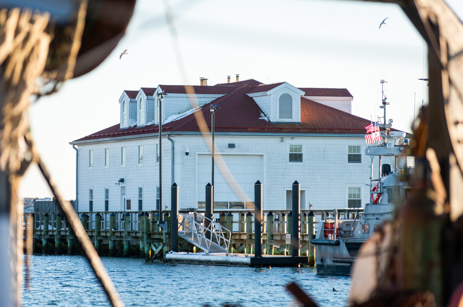 Coast Guard Station Menemsha seen from across the harbor.