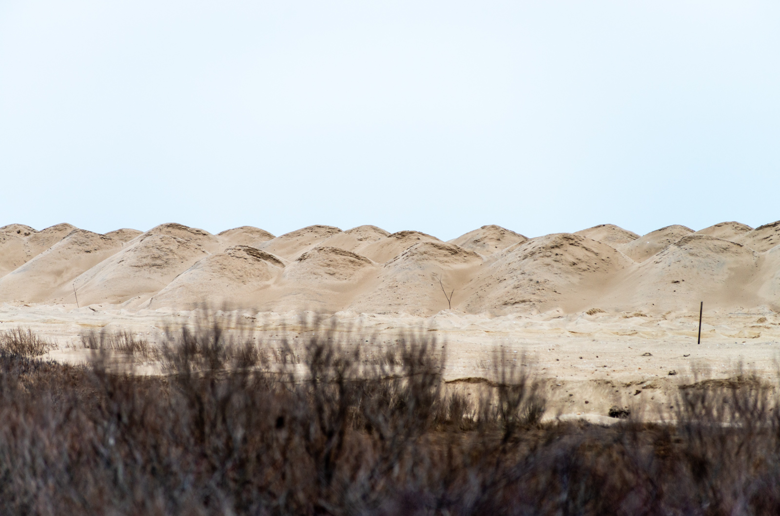 Piles of new sand placed along the entrance to Norton Point.