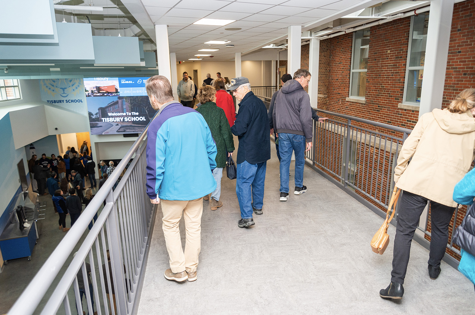 Tour groups cross the walkway.