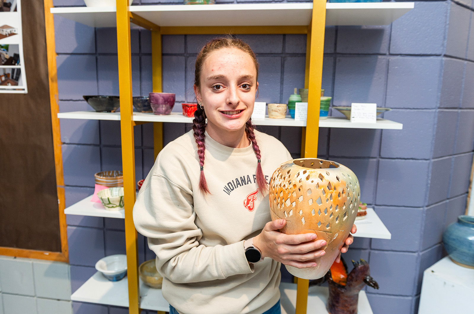 Isabella Burns with her pottery piece.