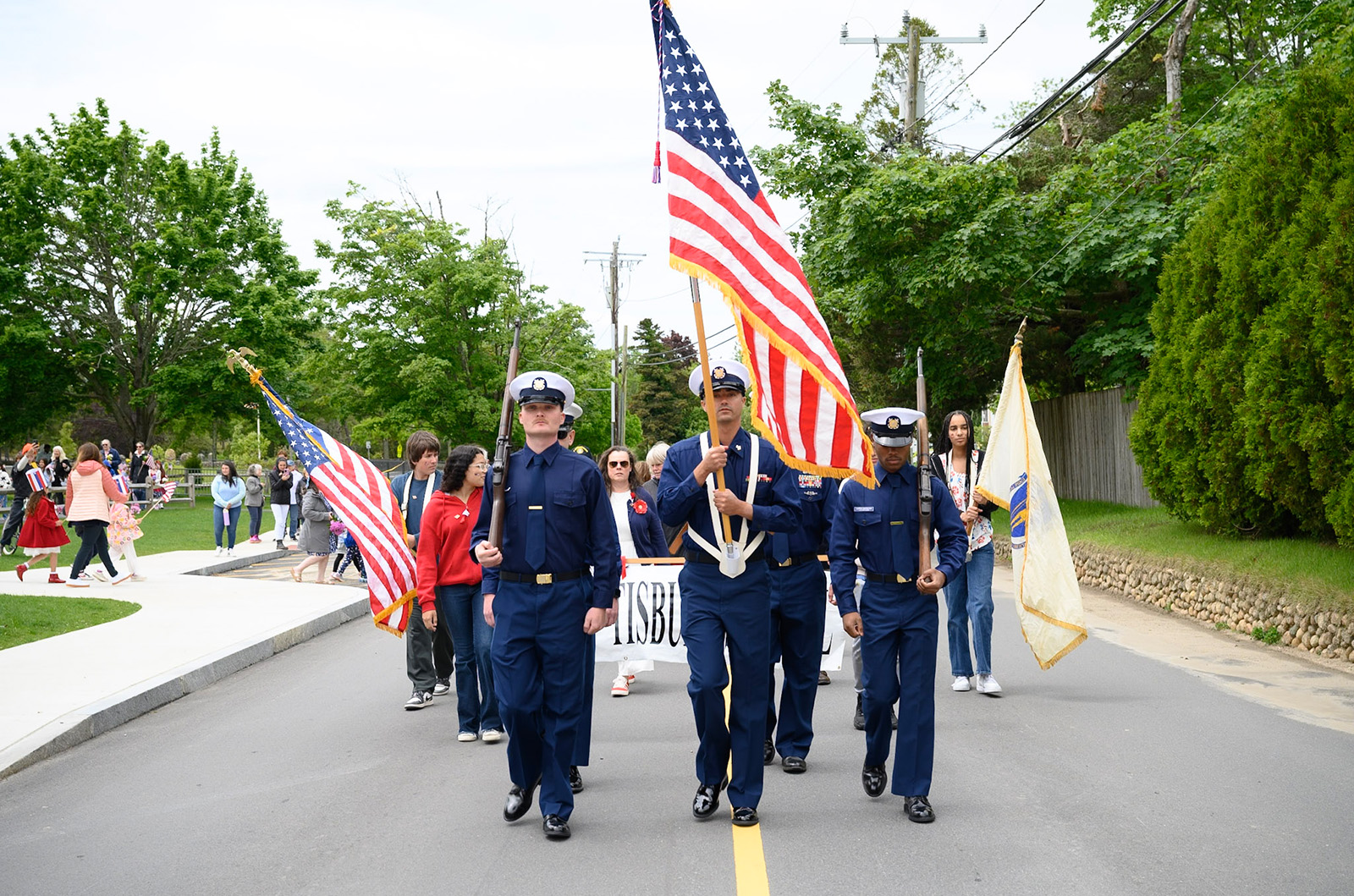 An honor guard leads the way.
