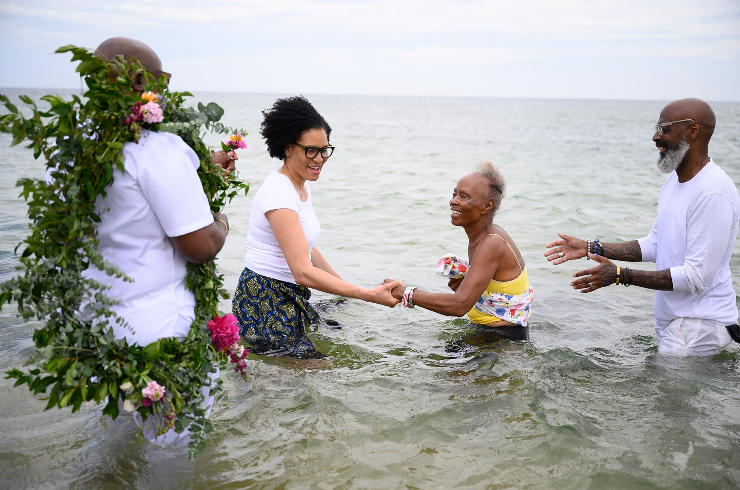 Dr. Frances Gaskin getting into the water with the help of Knowhere Art Gallery owner Valerie Francis.
