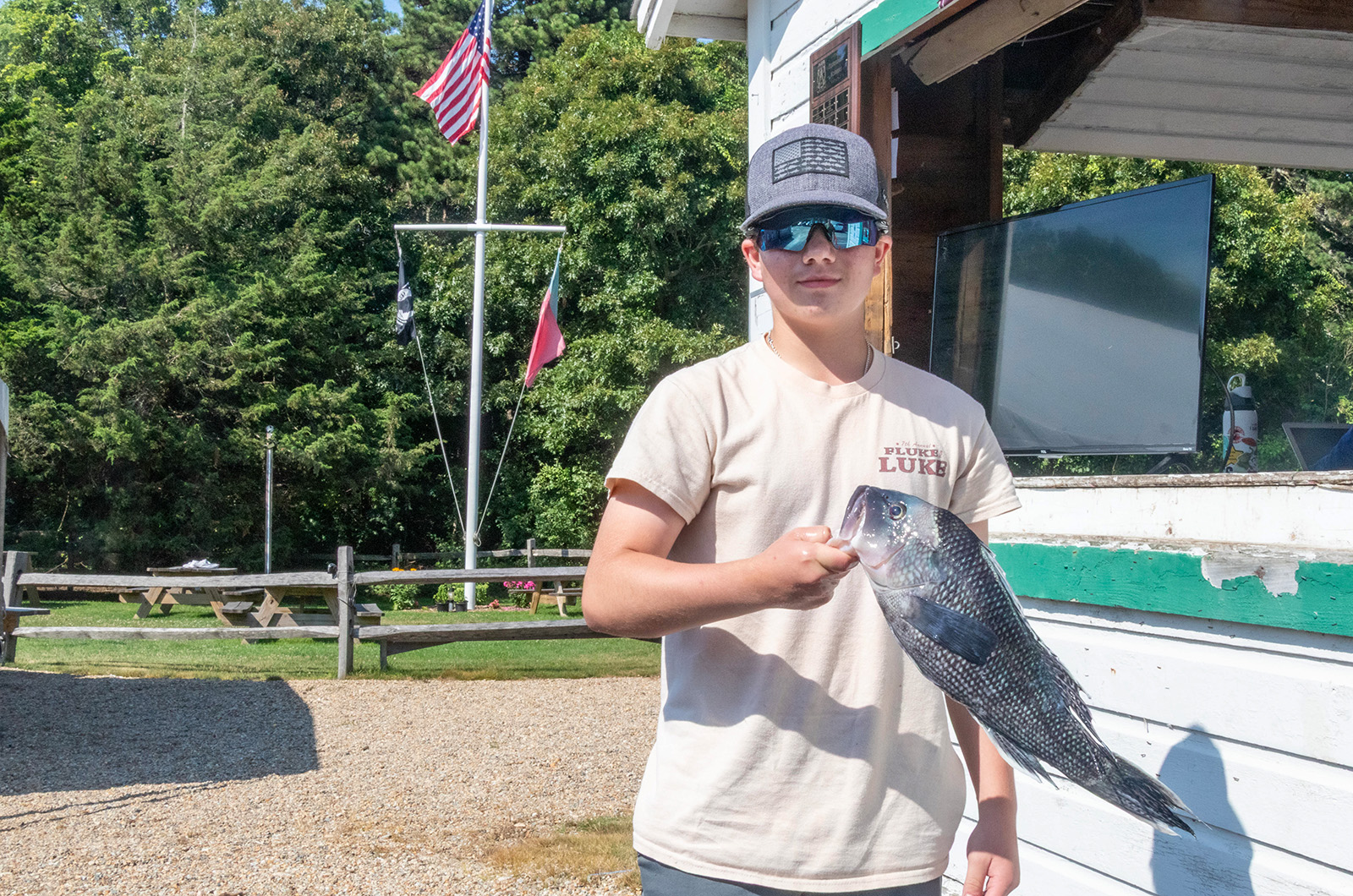 Jake Achele with a sea bass.
