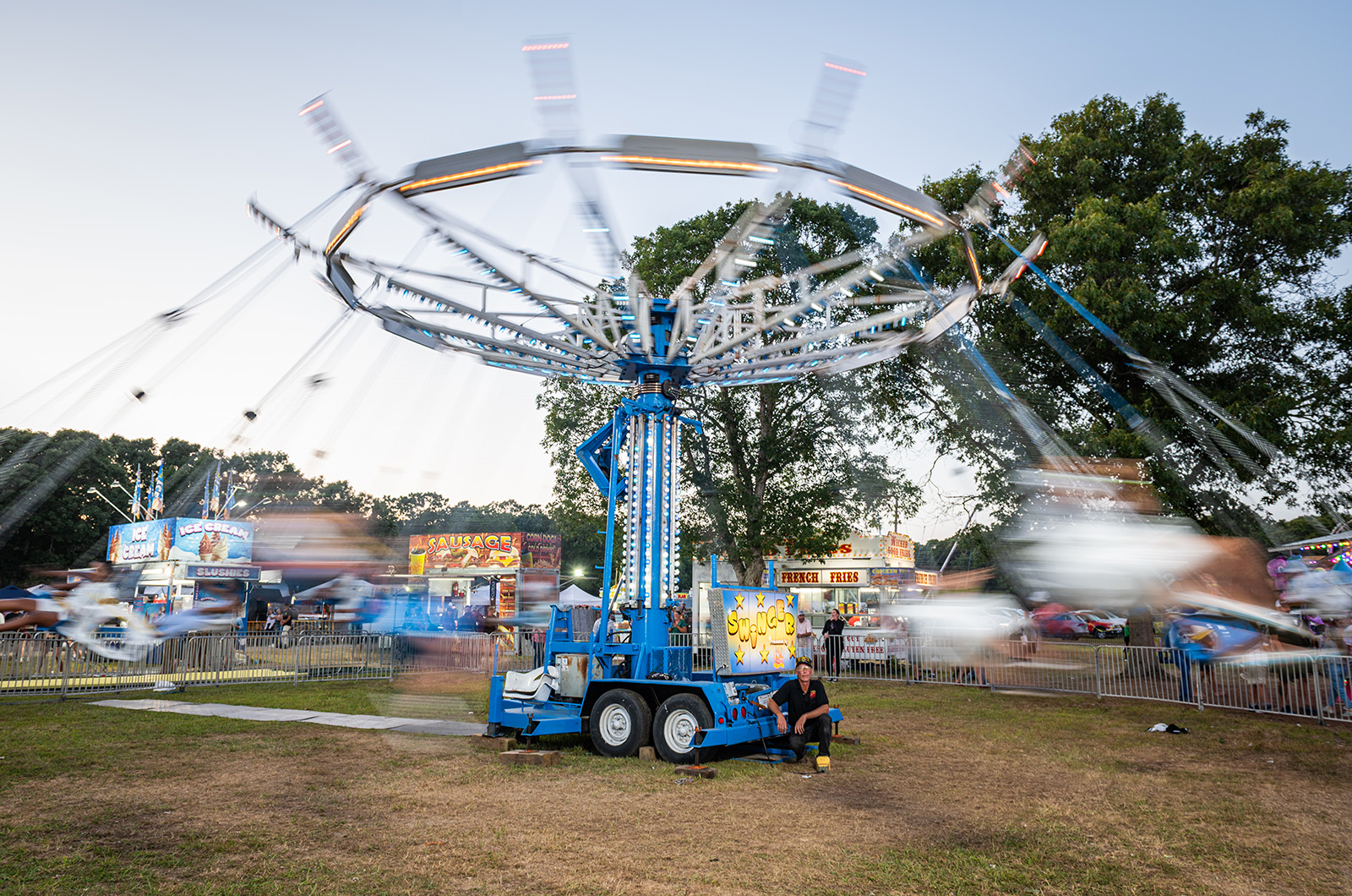 The rides keep spinning as the sun goes down.