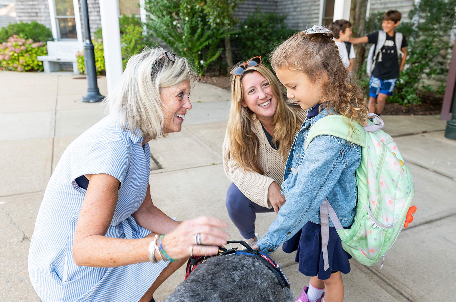 Edgartown School's new principal Kate Campbell introduces students to Shae, the therapy dog.