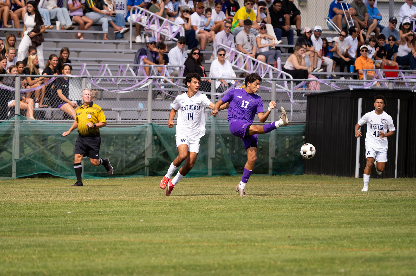 Caleb Miller clears it from a Nantucket player.