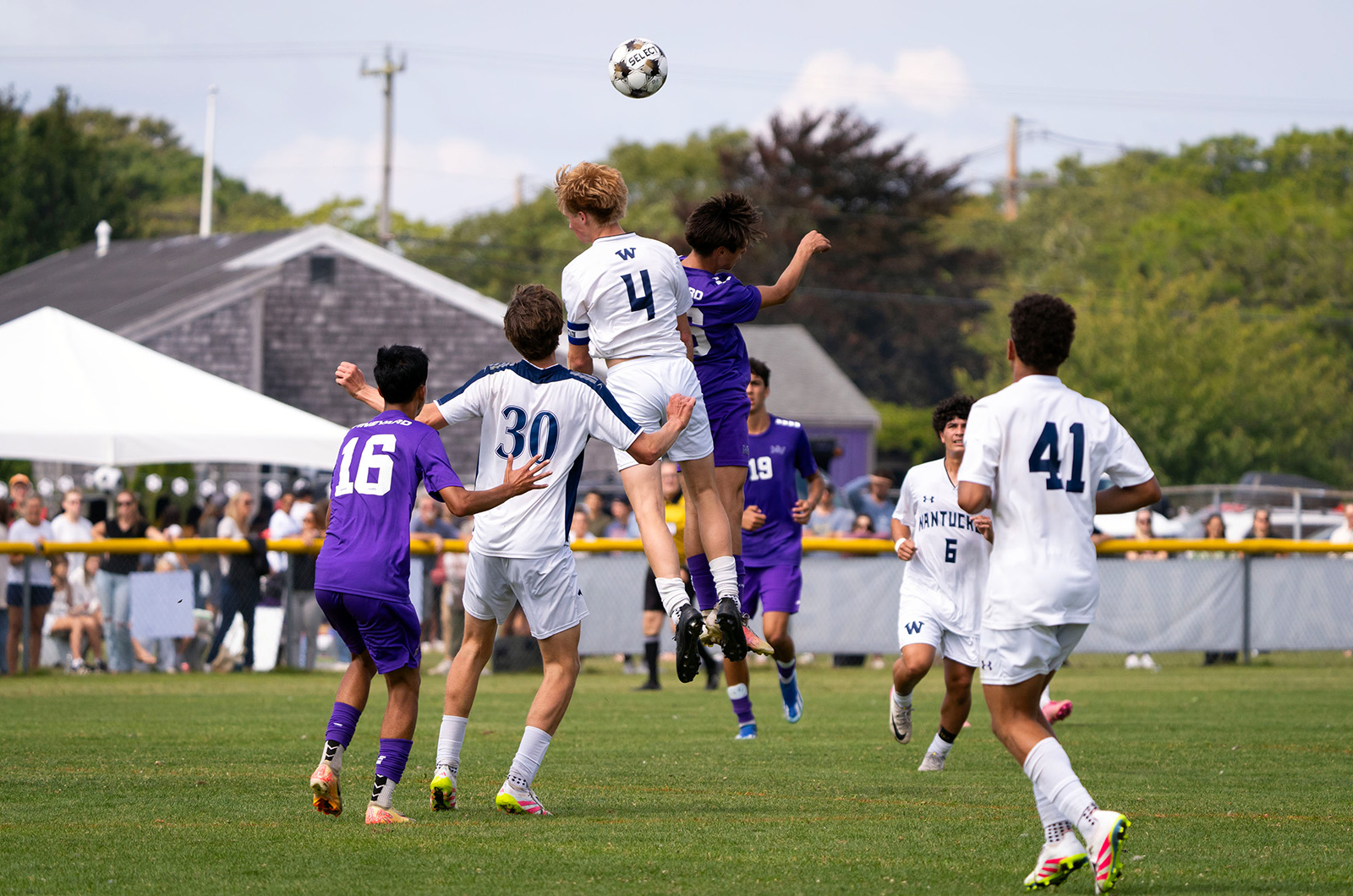Vineyard and Nantucket players rise up for the ball.