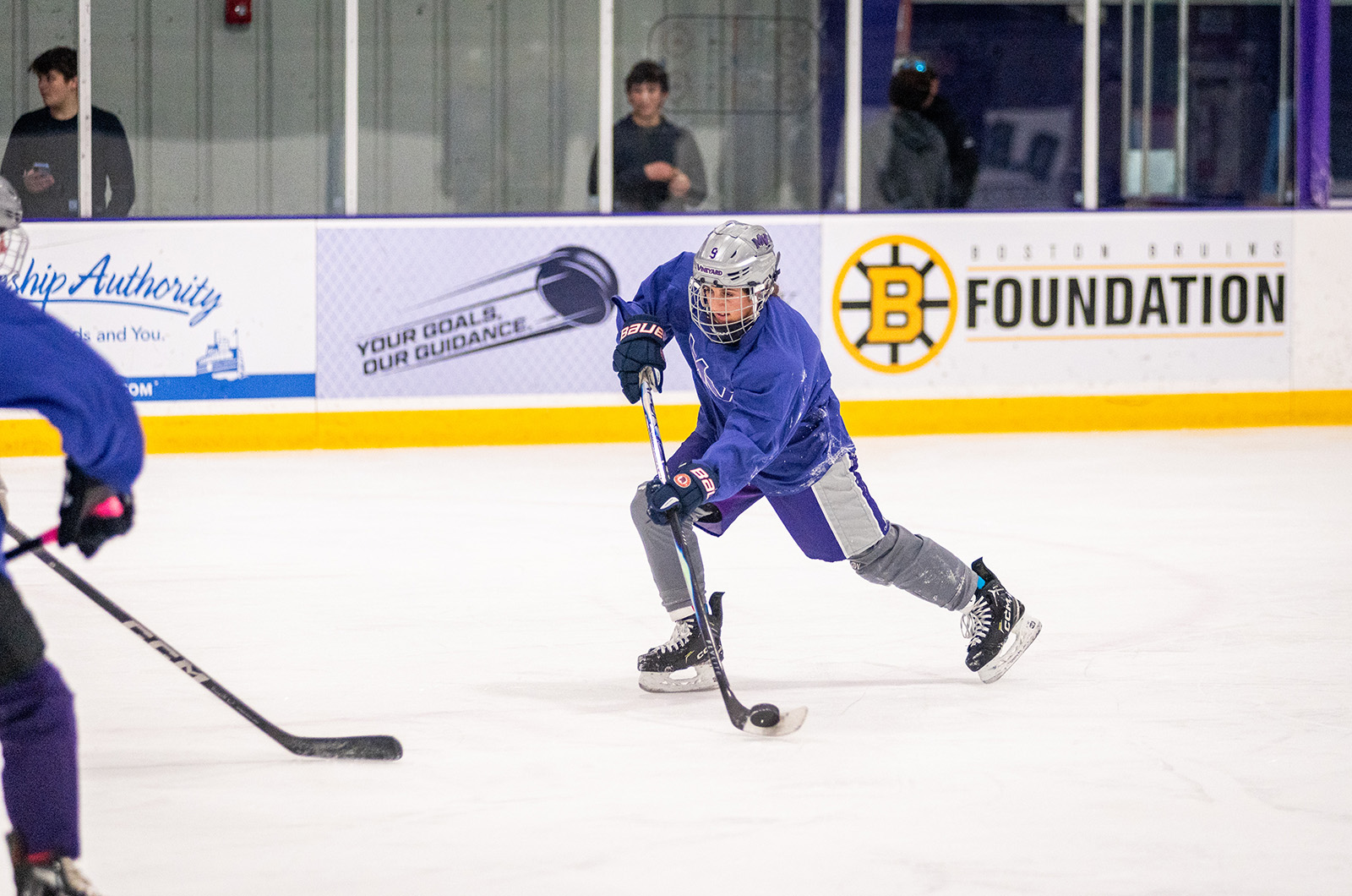 The girls hockey team practicing at the ice arena.