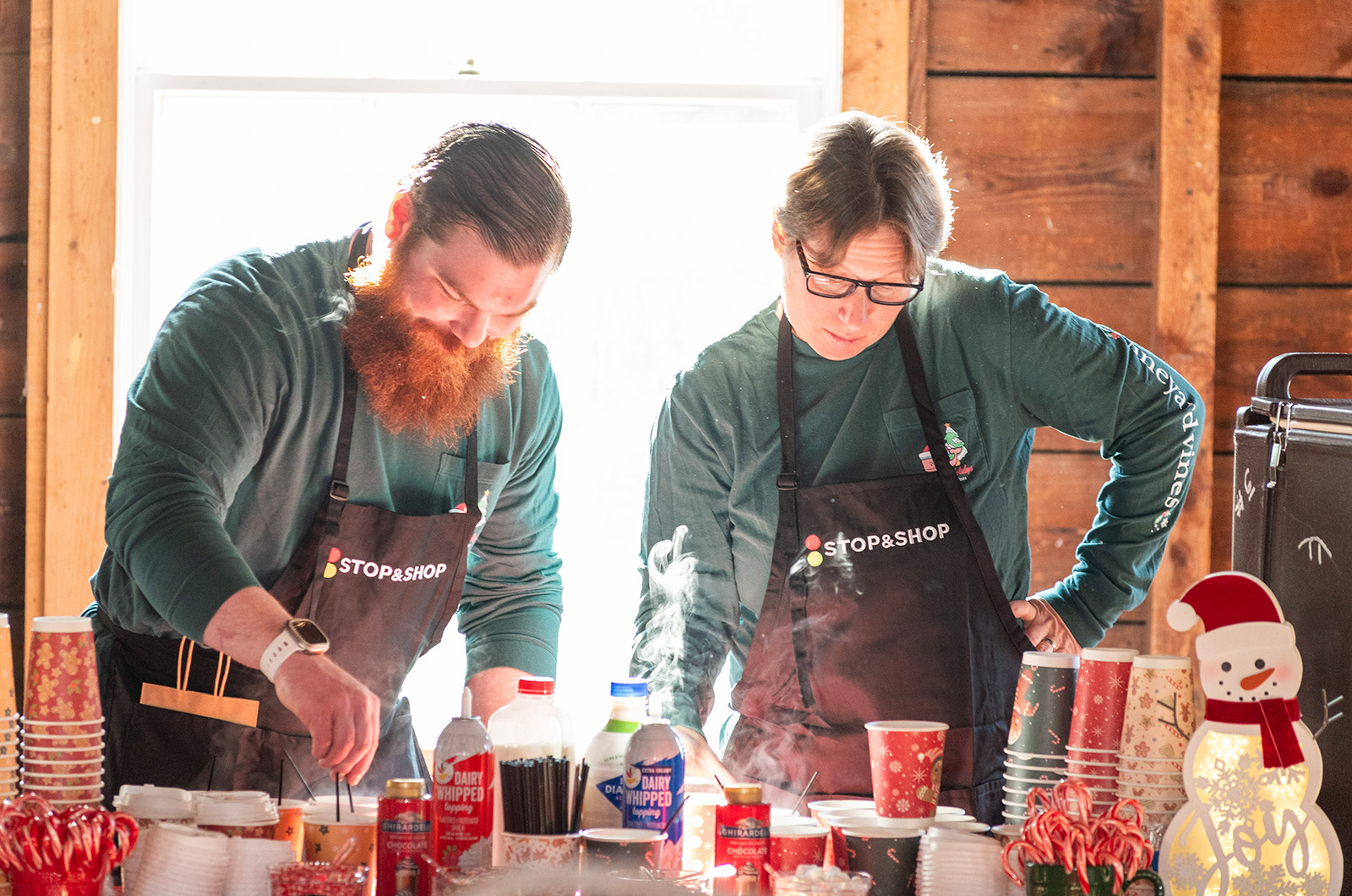 Jonathan Foster and Heather Van Murphy from Stop & Shop making hot cocoa.