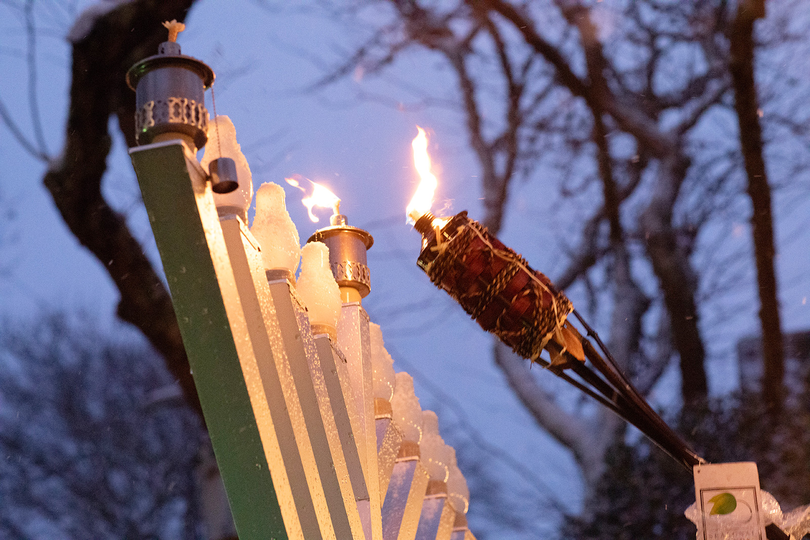 Lighting the first candle in the snow.