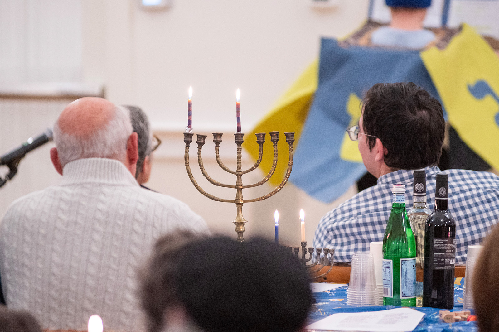 Islanders gather at the MV Hebrew Center to celebrate the first night of Hannukah.