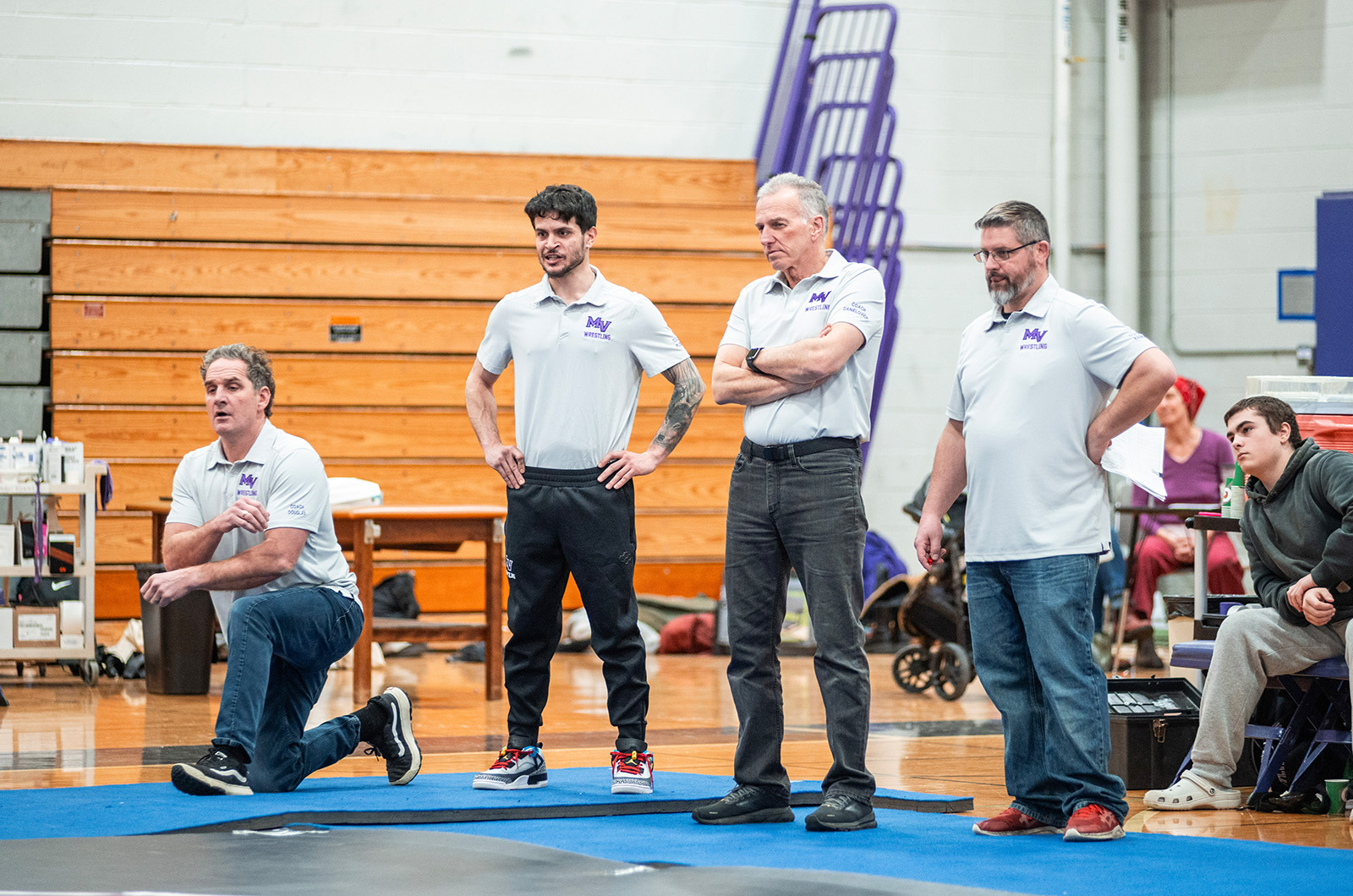 MVRHS wrestling coaches watching intently.