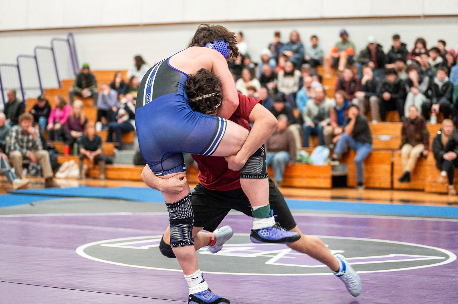 A Falmouth wrestler lifts up a Vineyarder.