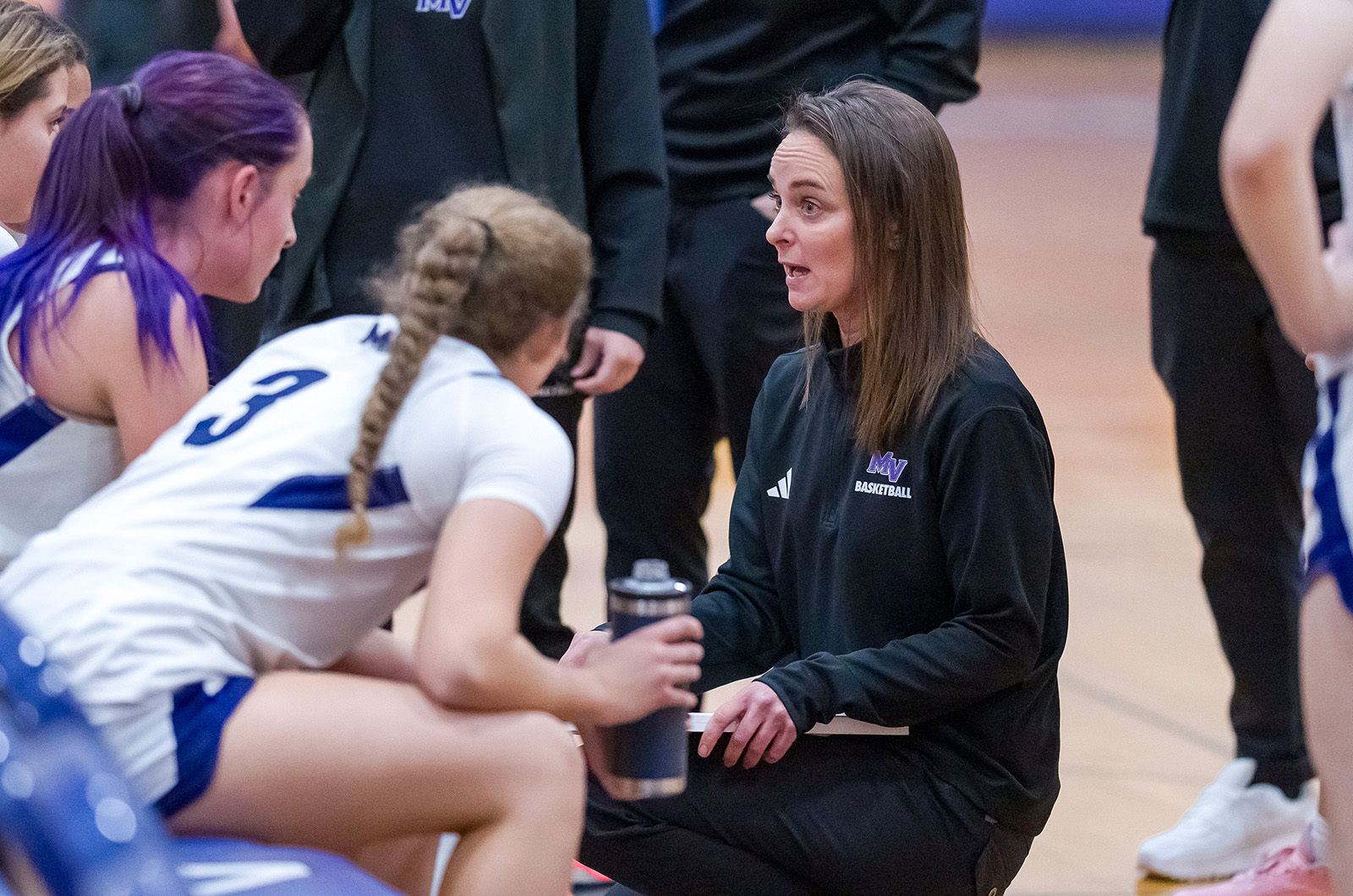 Coach Mary Korba giving some guidance.