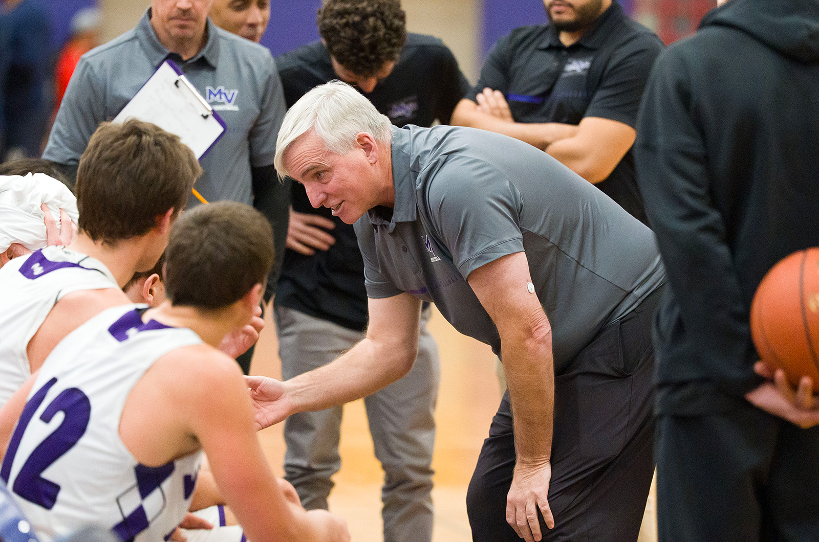 Boys coach Mike Joyce talking to the players.