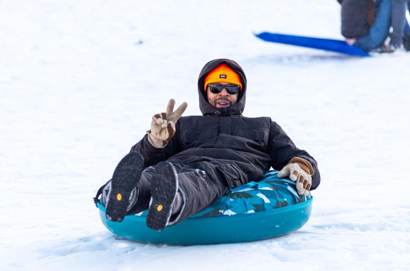Grown-ups enjoyed the sledding as well.