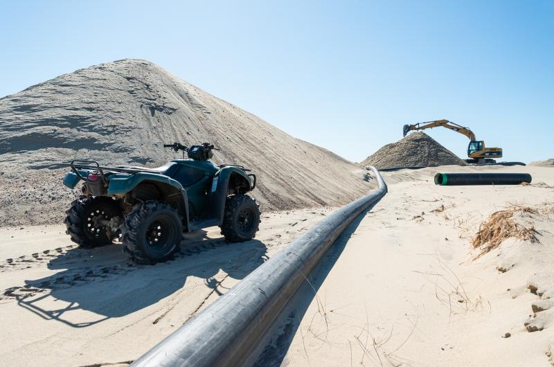 Large piles of sand dredged from the bottom of Edgartown Great Pond.