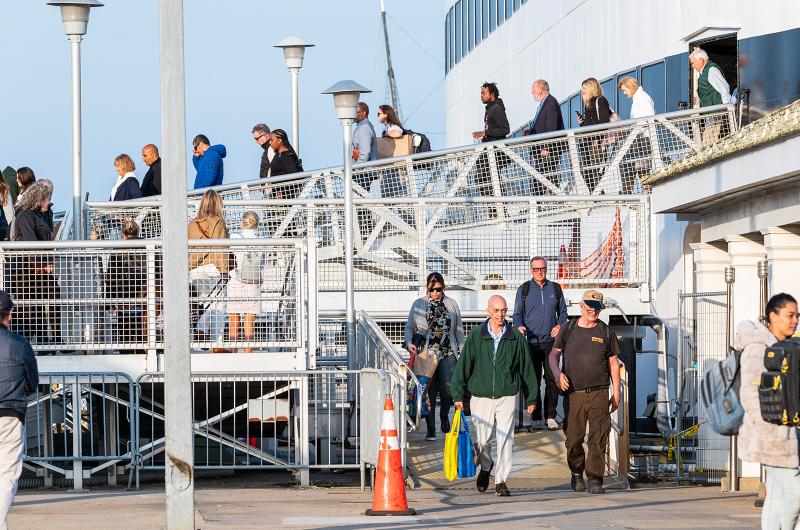 The ferry unloads its contents of passengers.