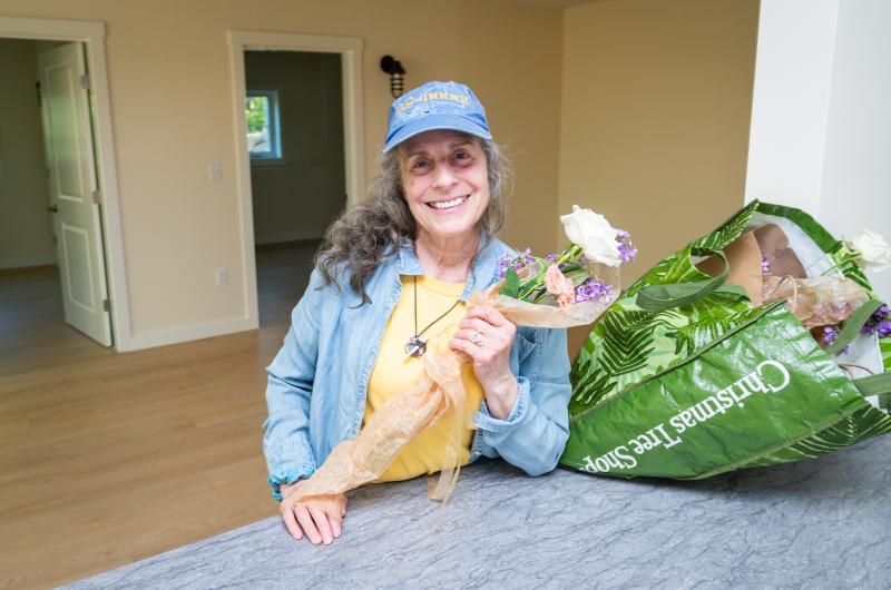 Pam Glavin left roses for the new tenants in the project which bears her late husband's name.