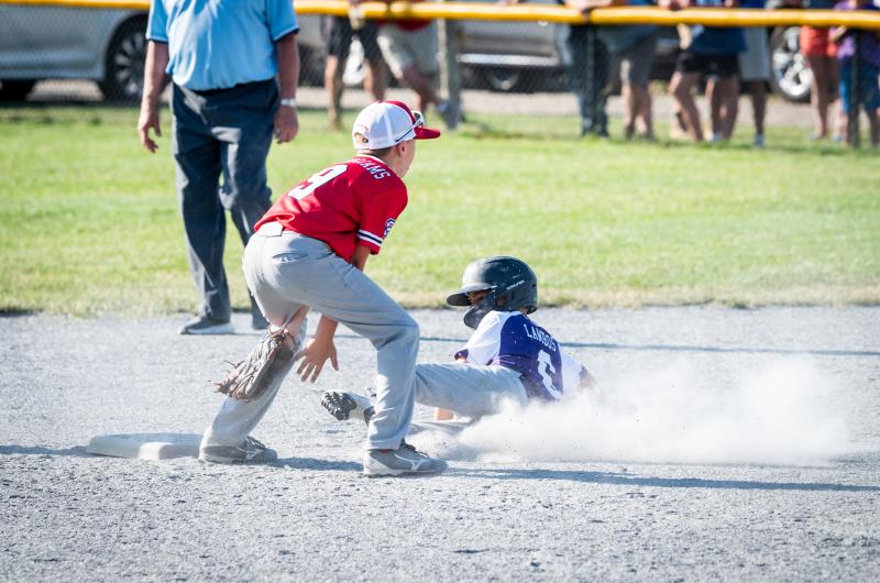 Graham Lambos sliding into 2nd base.