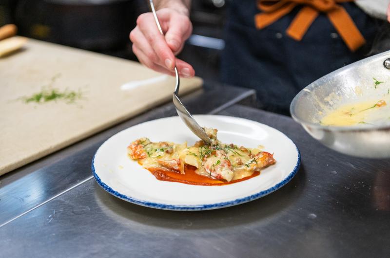 Testing the lobster mezzaluna.