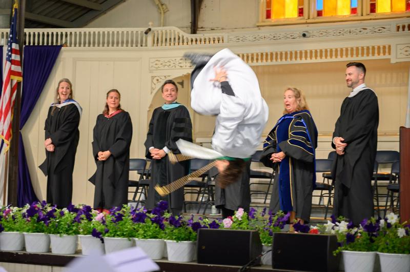 Pedro Alves performs a backflip after getting his diploma.