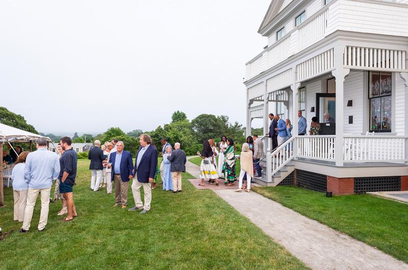 Guests move to the front lawn for dinner.