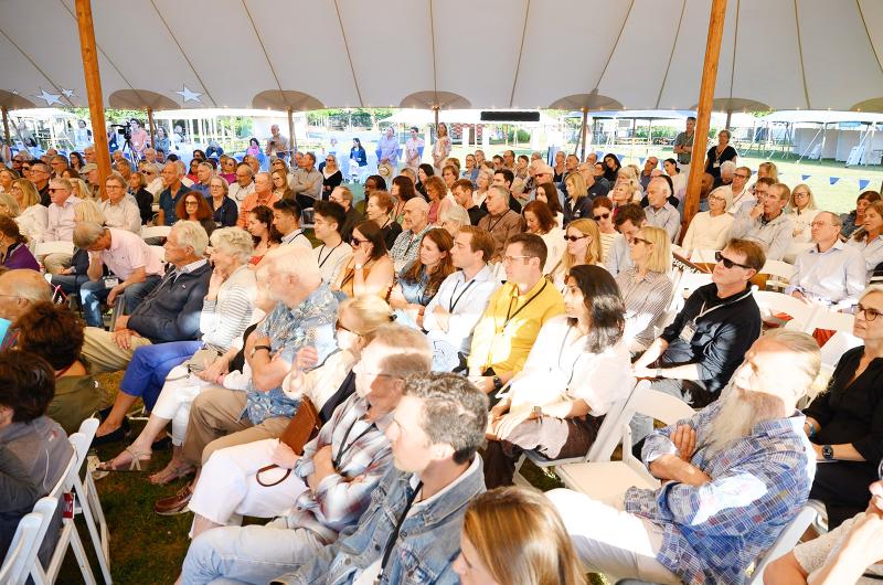 A packed house under the tent.