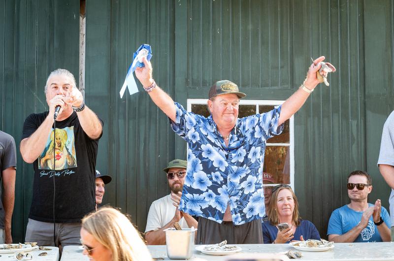 Captain Teddy Karalekas is once again crowned oyster shucking champion.