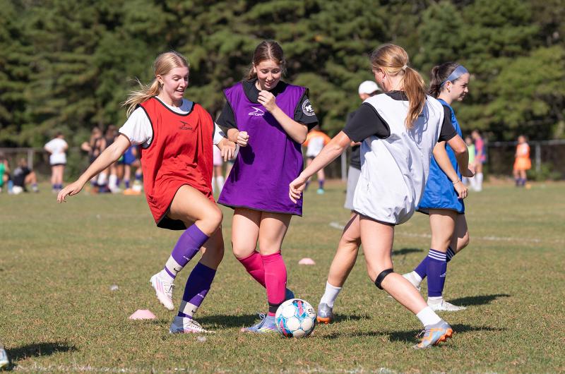 Girls soccer hopefuls go at it.