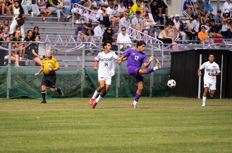 Caleb Miller clears it from a Nantucket player.