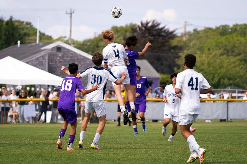 Vineyard and Nantucket players rise up for the ball.