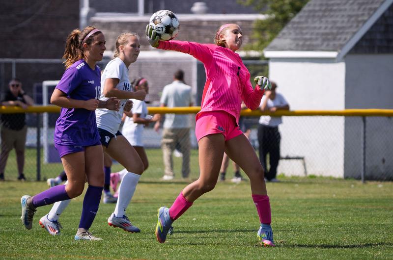 Vineyard goalie Delilah Oliver moves the ball forward.