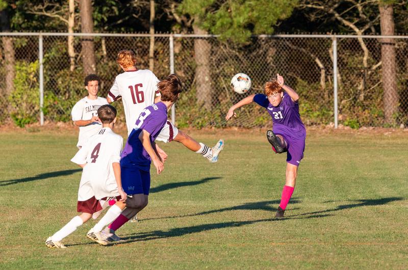 A defender on the JV team clears the ball.