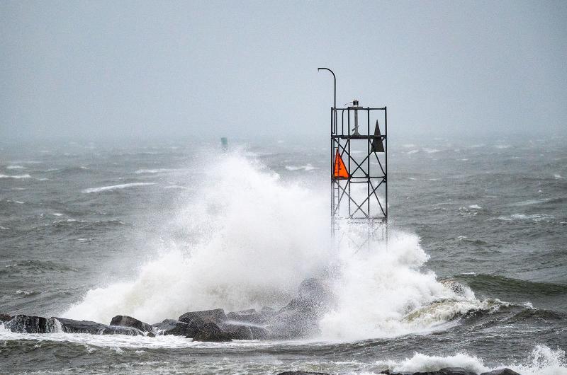 Wave breaks on Oak Bluffs harbor jetty.
