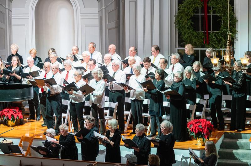 The stage overflowed with singers and instruments.