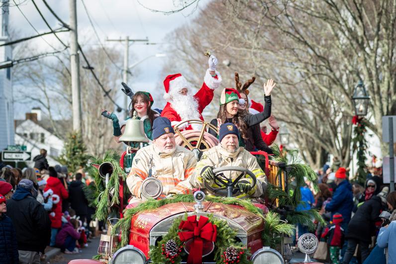 Santa rides along with Peter Shemeth and Scott Ellis with the Edgartown Fire Department.