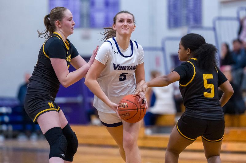 Olivia McCormick pushes through Nauset defenders.