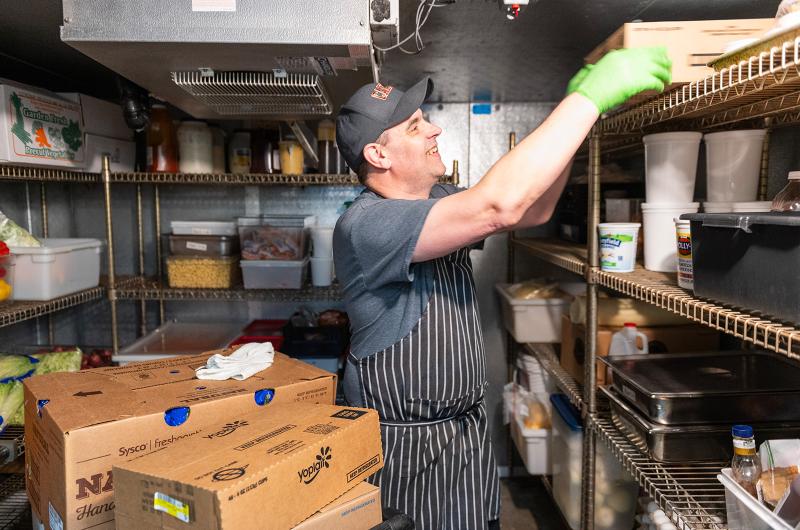 Marc Brasefield (food services manager) in the walk-in.
