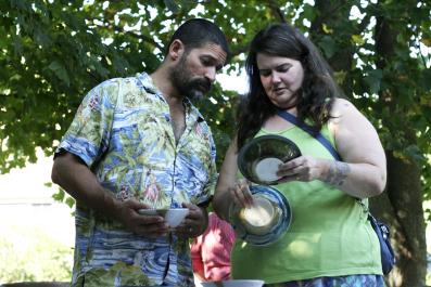 couple looks at pottery